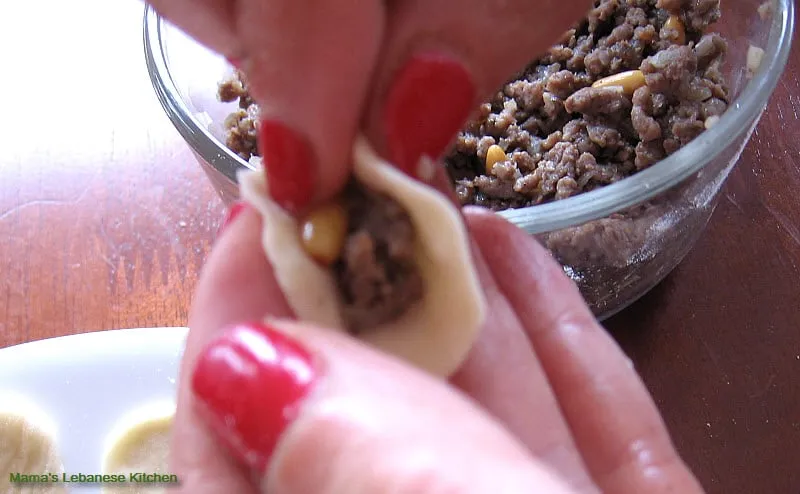 Place meat fillings inside each dough Shish Barak Yogurt Recipe
