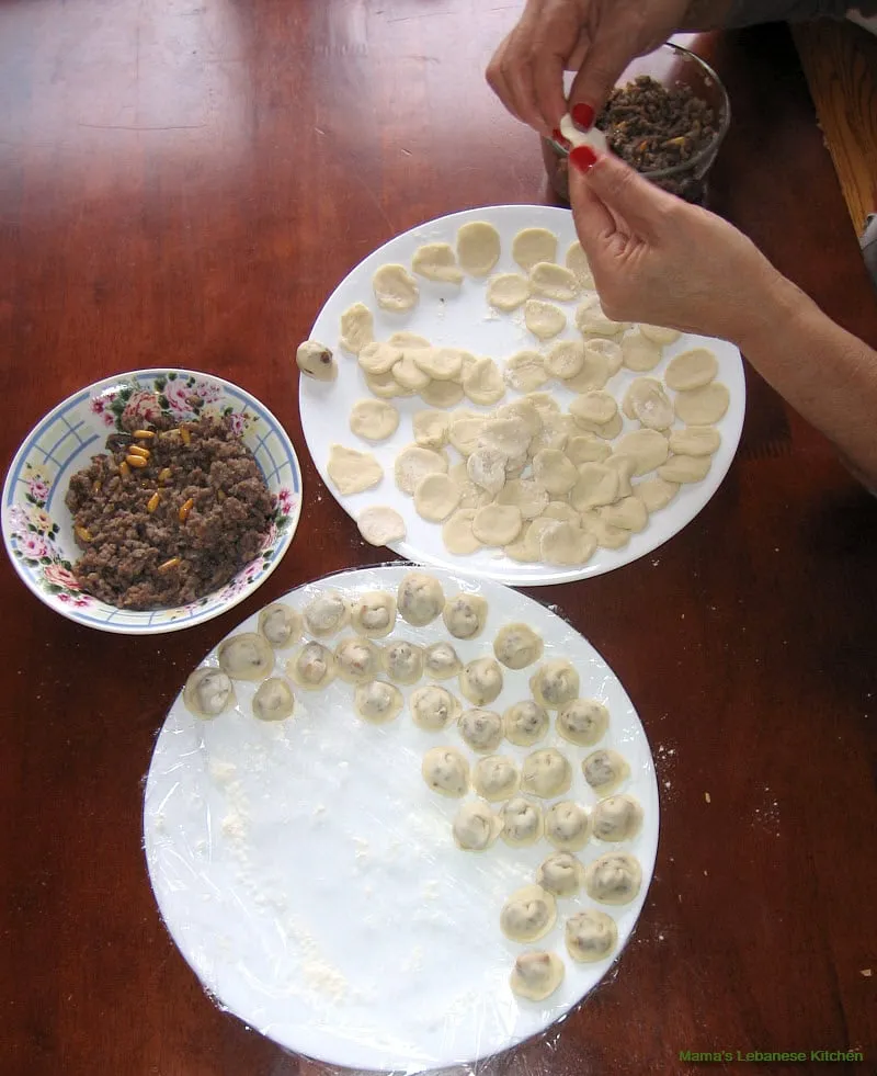 Lineup the dumplings on a plate dusted with flour Lebanese Meat Dumplings Yogurt Stew