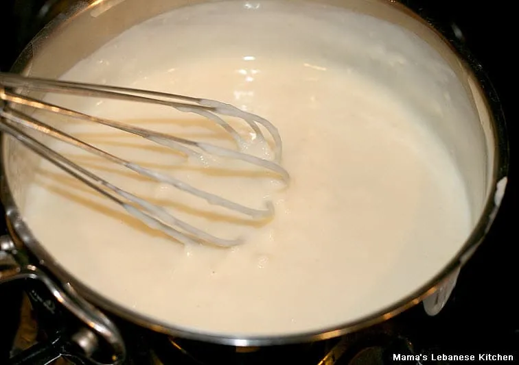 Gently Boil Milk, Rice, and Corn Flour While Stirring Lebanese Rice Pudding Dessert